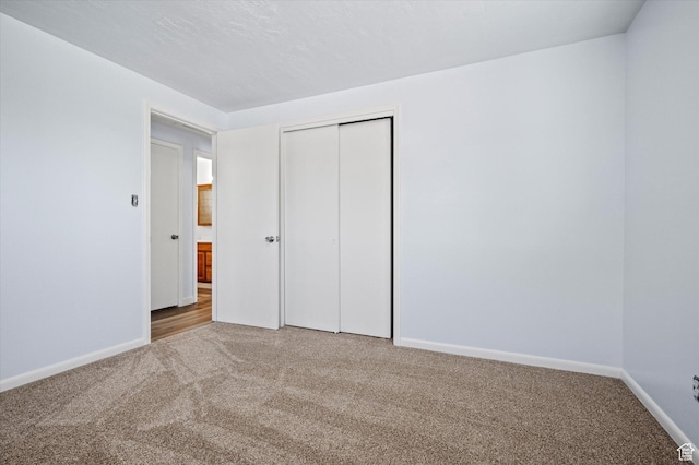 940 Fillmore Ave, Ogden, UT 84404 - unfurnished bedroom featuring carpet, a closet, and baseboards