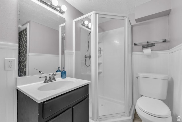 11873 S Coles Camp Cir W, Herriman, UT 84096 - bathroom featuring a shower stall, a textured ceiling, and a wainscoted wall