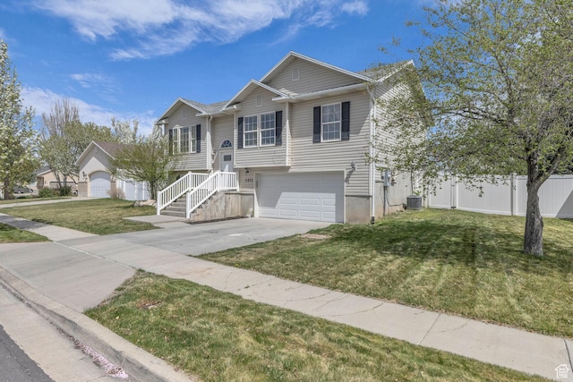 11873 S Coles Camp Cir W, Herriman, UT 84096 - bi-level home featuring a garage, concrete driveway, fence, central air condition unit, and a front lawn