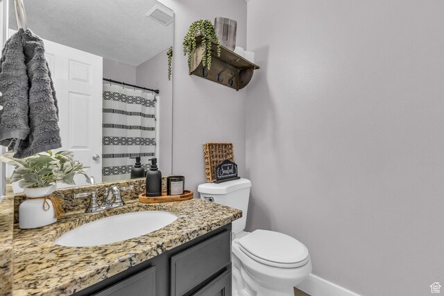 11873 S Coles Camp Cir W, Herriman, UT 84096 - full bath with visible vents, baseboards, a shower with shower curtain, toilet, and vanity