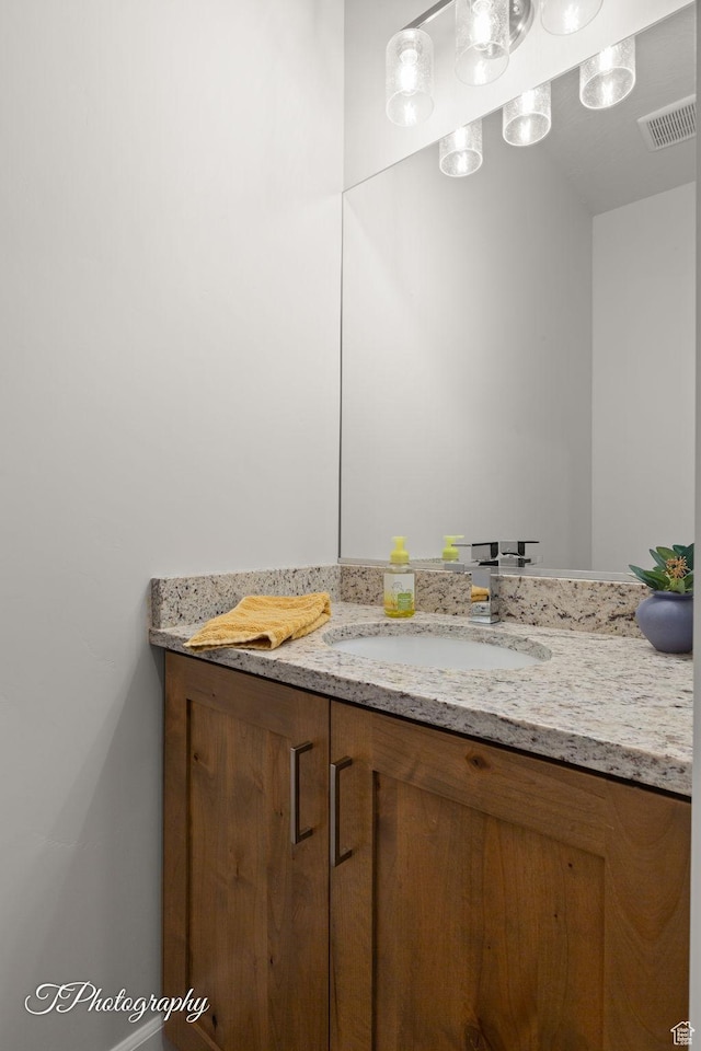bathroom featuring visible vents and vanity