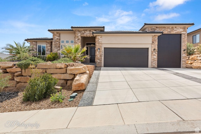 prairie-style house featuring a tiled roof, driveway, stucco siding, and an attached garage