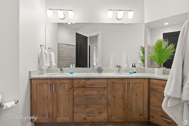bathroom featuring double vanity and a sink