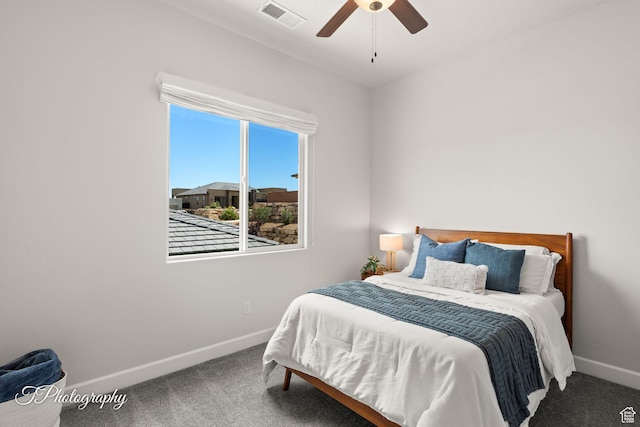 carpeted bedroom with ceiling fan, baseboards, and visible vents
