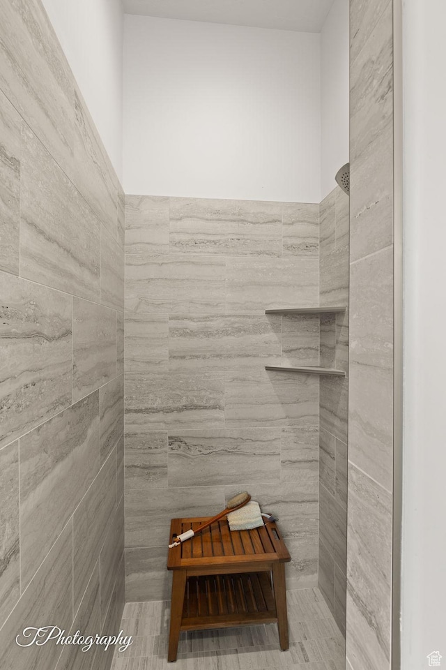bathroom with tile walls