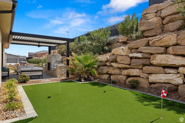 view of yard with area for grilling, outdoor lounge area, a patio area, and fence