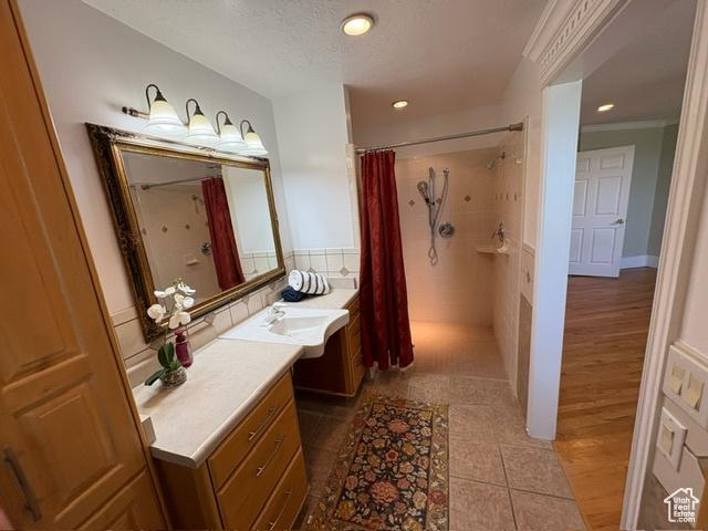 506 S 1200 E, Bountiful, UT 84010 - bathroom with vanity, curtained shower, recessed lighting, and tile patterned flooring