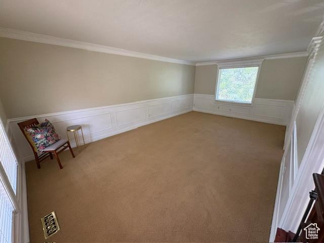 506 S 1200 E, Bountiful, UT 84010 - empty room with carpet, wainscoting, and crown molding