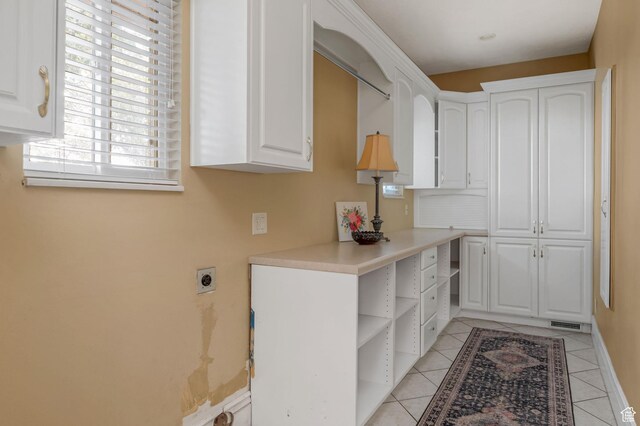 506 S 1200 E, Bountiful, UT 84010 - clothes washing area featuring light tile patterned floors, electric dryer hookup, visible vents, baseboards, and cabinet space