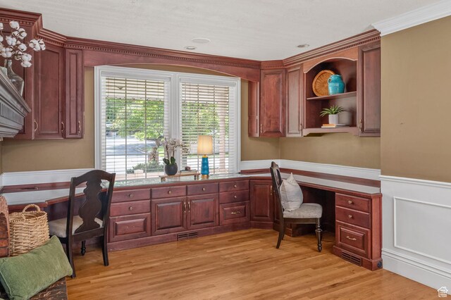 506 S 1200 E, Bountiful, UT 84010 - office featuring crown molding, light wood-style flooring, visible vents, built in desk, and wainscoting