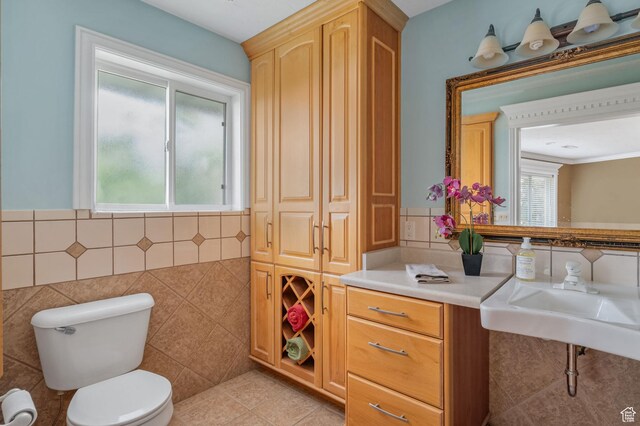 506 S 1200 E, Bountiful, UT 84010 - bathroom featuring tile patterned floors, tile walls, a sink, and toilet