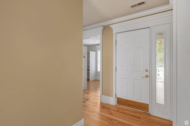 506 S 1200 E, Bountiful, UT 84010 - entryway with light wood-type flooring, visible vents, baseboards, and crown molding