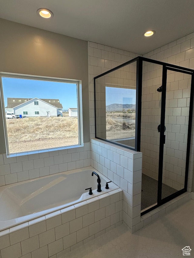 bathroom featuring a shower stall, a garden tub, tile patterned flooring, and recessed lighting