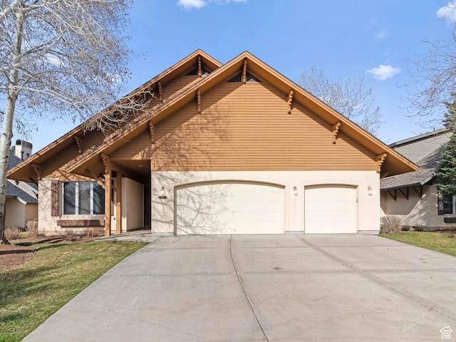 view of front facade featuring a front lawn, a garage, and concrete driveway