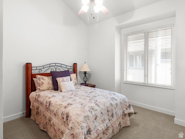 carpeted bedroom featuring baseboards, a ceiling fan, and vaulted ceiling