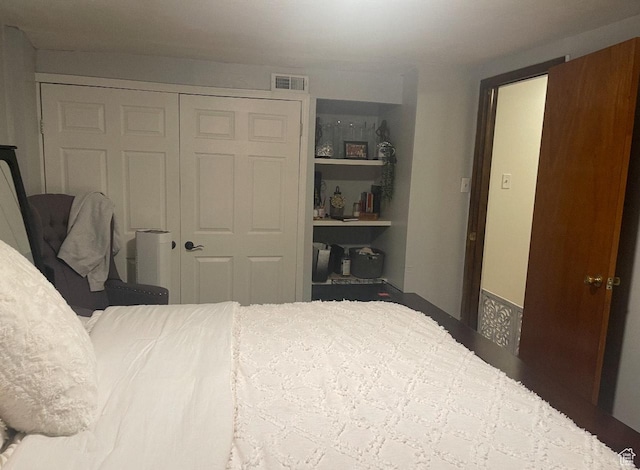 bedroom featuring a closet and visible vents