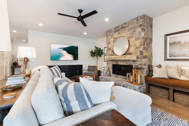 living area with a fireplace, wood finished floors, ceiling fan, and recessed lighting