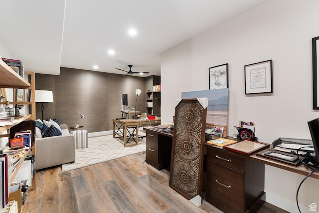 office space with baseboards, recessed lighting, a ceiling fan, and light wood-style flooring