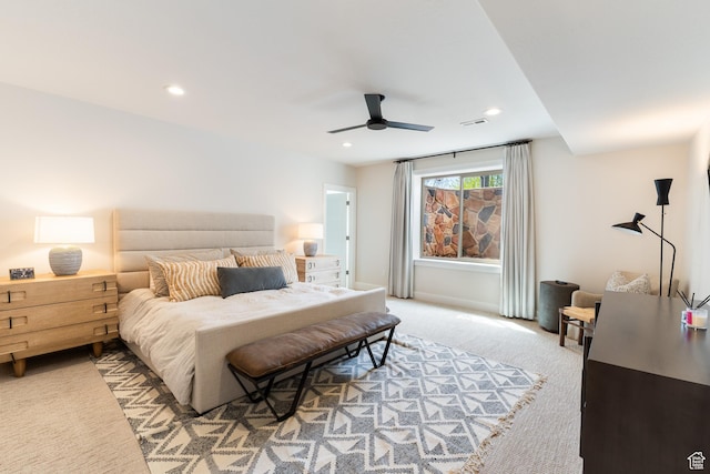 bedroom with light carpet, a ceiling fan, visible vents, and recessed lighting