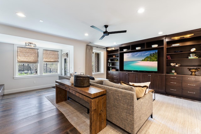 cinema room featuring baseboards, a ceiling fan, light wood finished floors, and recessed lighting