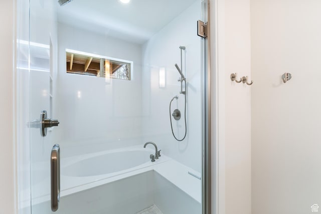 full bathroom with a shower and a bathing tub