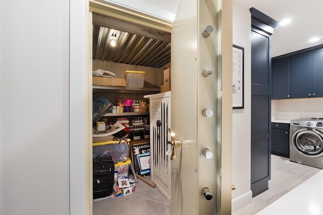 interior space featuring cabinet space and washer / clothes dryer
