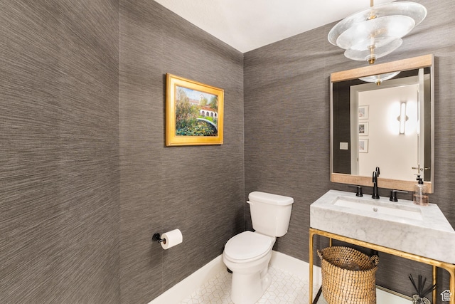 bathroom with tile patterned flooring, toilet, and vanity