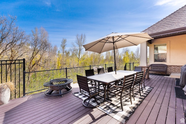 wooden deck with outdoor dining space
