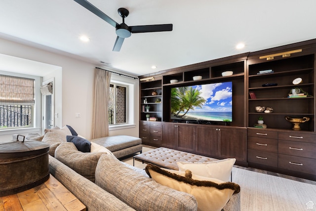 cinema featuring recessed lighting, light wood finished floors, visible vents, and a ceiling fan