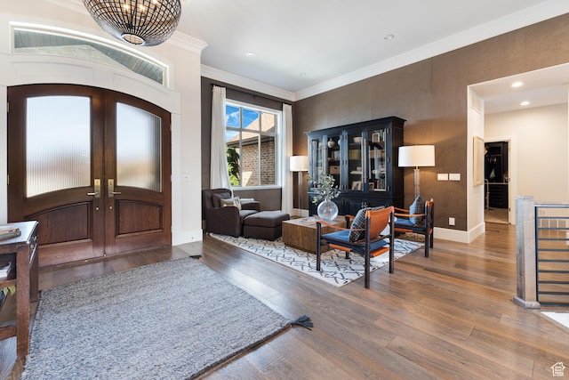 foyer entrance featuring recessed lighting, wood finished floors, ornamental molding, french doors, and baseboards