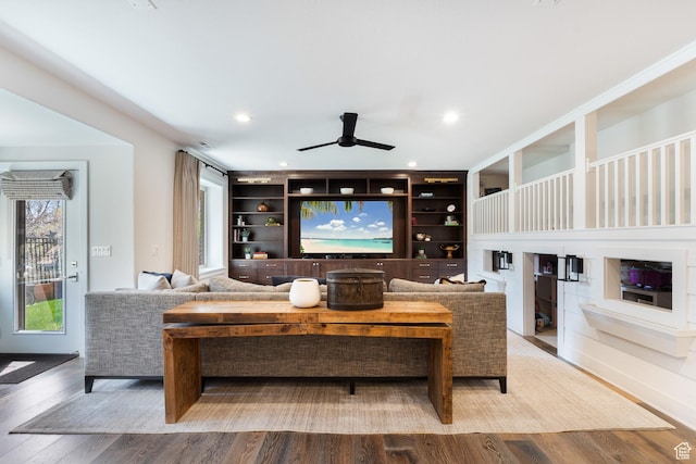 living room with recessed lighting, wood finished floors, a wealth of natural light, and ceiling fan