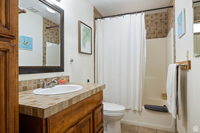 247 S 100 E, Hurricane, UT 84737 - bathroom featuring shower / tub combo, vanity, tile patterned flooring, toilet, and visible vents