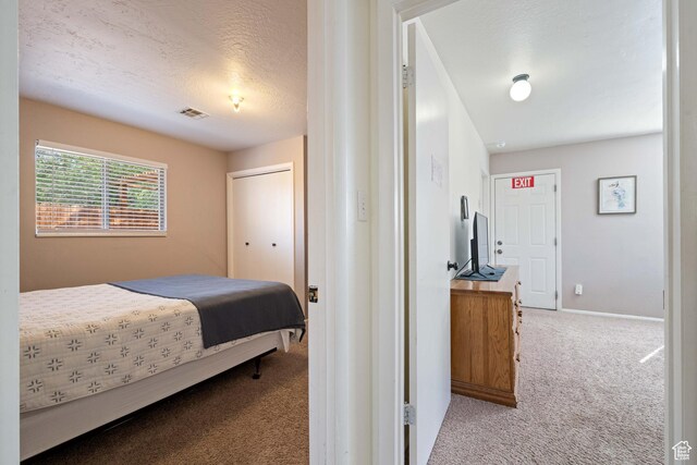 247 S 100 E, Hurricane, UT 84737 - carpeted bedroom featuring visible vents, a textured ceiling, and baseboards