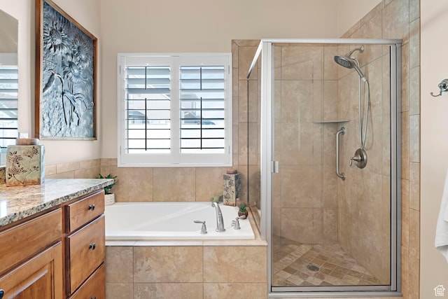 10756 S Autumn Wind Way W, South Jordan, UT 84009 - bathroom with vanity, a garden tub, and a stall shower
