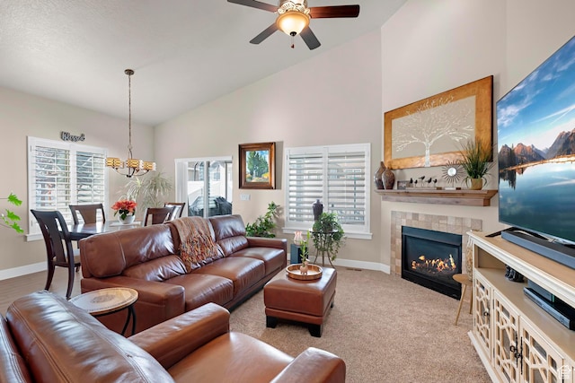 10756 S Autumn Wind Way W, South Jordan, UT 84009 - living room with high vaulted ceiling, a tile fireplace, ceiling fan with notable chandelier, and baseboards