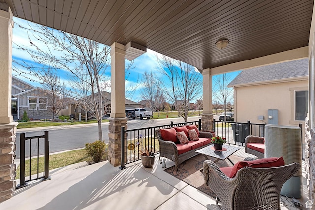 10756 S Autumn Wind Way W, South Jordan, UT 84009 - view of patio with a residential view, outdoor lounge area, and covered porch