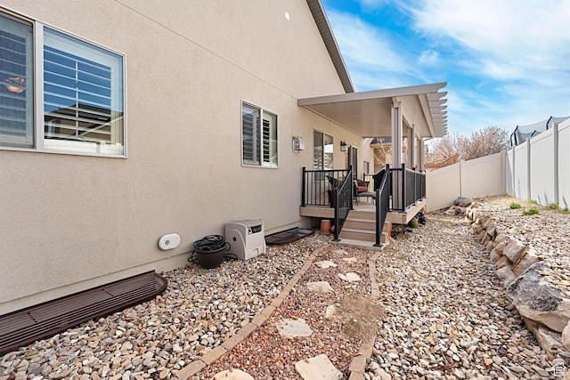 10756 S Autumn Wind Way W, South Jordan, UT 84009 - view of side of home with fence and stucco siding