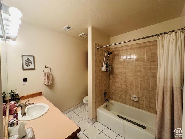 470 E Bridlewalk Ln S, Murray, UT 84107 - full bathroom featuring vanity, tile patterned floors, shower / bath combination with curtain, toilet, and visible vents