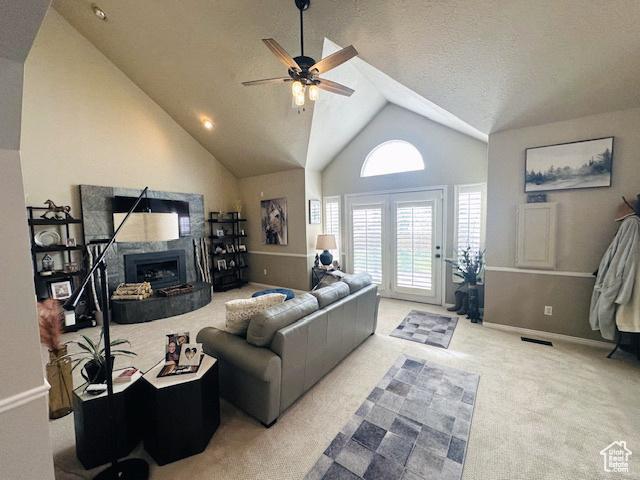 470 E Bridlewalk Ln S, Murray, UT 84107 - living area with a high end fireplace, ceiling fan, vaulted ceiling, carpet flooring, and baseboards