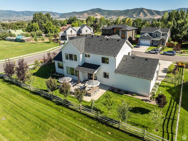 drone / aerial view featuring a mountain view and a residential view
