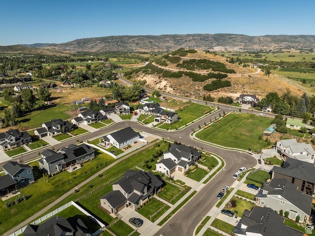 drone / aerial view with a residential view and a mountain view