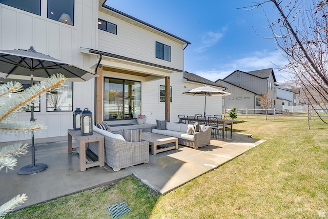 view of patio featuring outdoor lounge area and fence