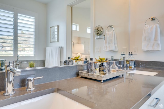 bathroom with a wealth of natural light and a sink
