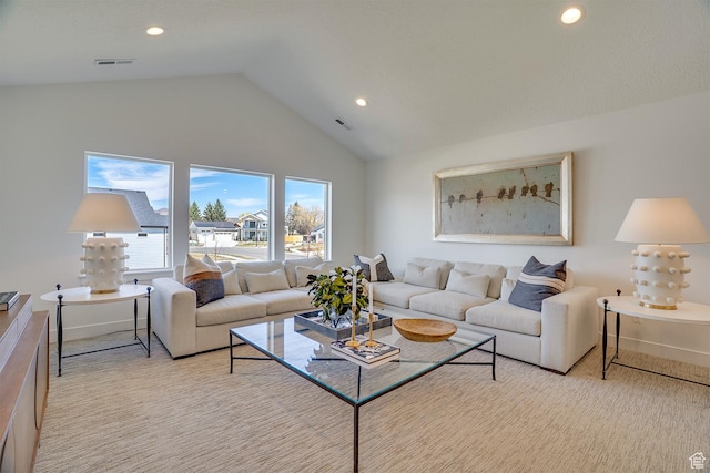 living room featuring high vaulted ceiling, light colored carpet, visible vents, and recessed lighting