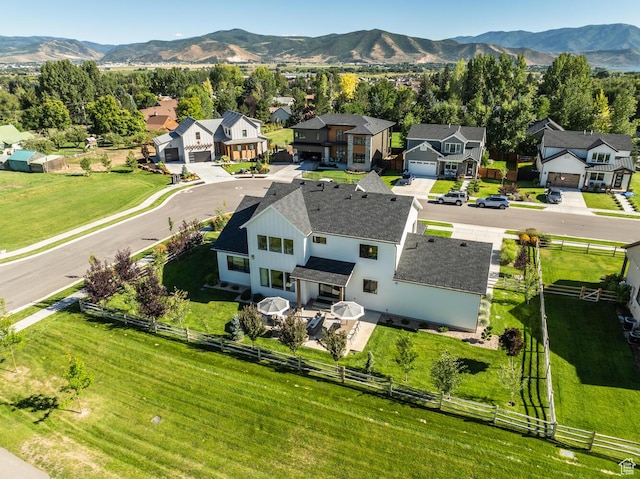 birds eye view of property with a mountain view and a residential view