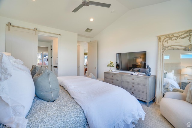 bedroom featuring visible vents, a barn door, a ceiling fan, recessed lighting, and vaulted ceiling