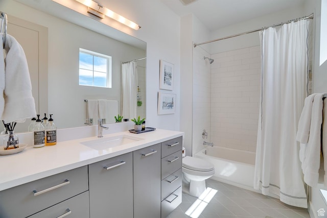 full bathroom featuring toilet, shower / bathtub combination with curtain, vanity, and tile patterned flooring