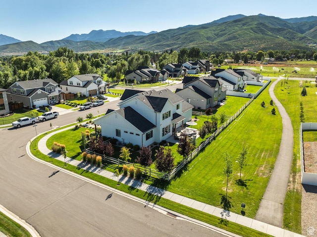 birds eye view of property with a mountain view and a residential view