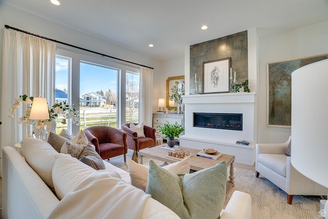 living area with recessed lighting and a fireplace
