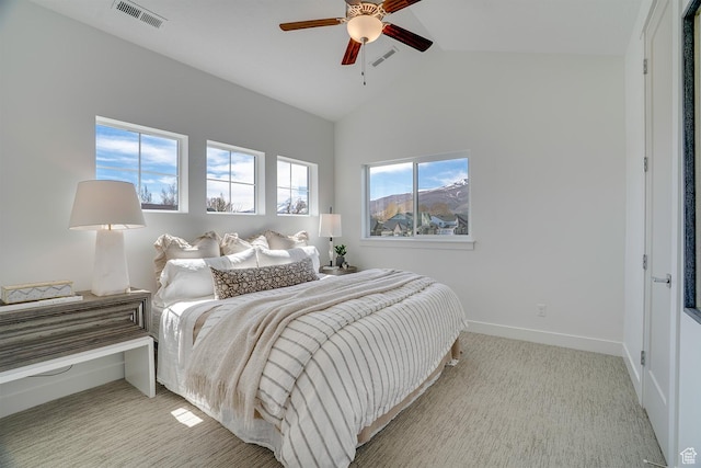bedroom featuring light carpet, baseboards, vaulted ceiling, and visible vents